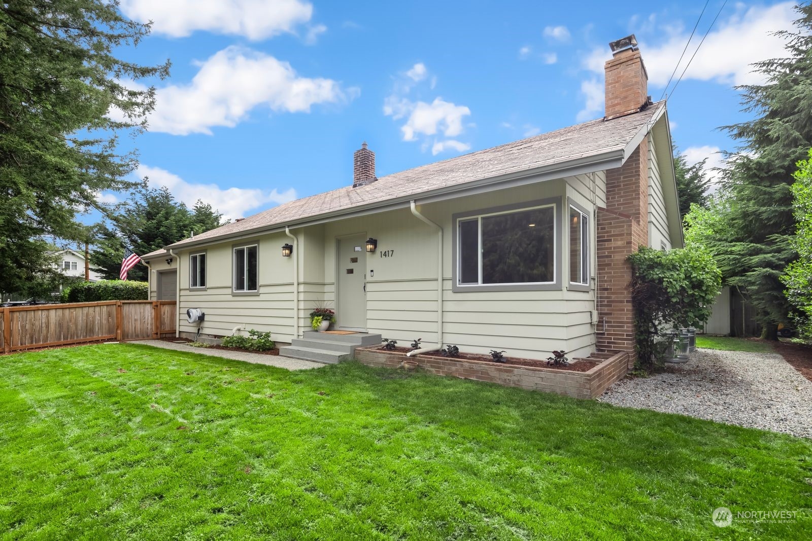 1417 North 40th Street Renton, WA 98056 - Photo 1 of 33 a front view of house with yard and seating area