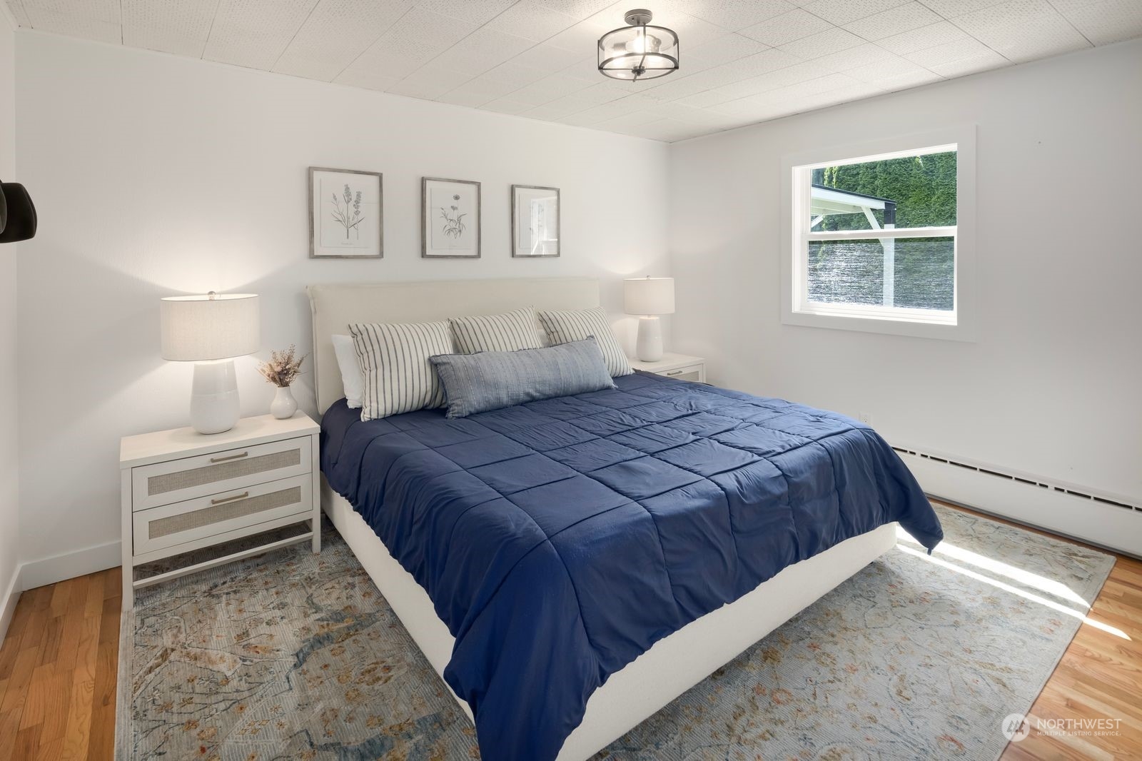 1417 North 40th Street Renton, WA 98056 - Photo 13 of 33 a bedroom with a bed and a window