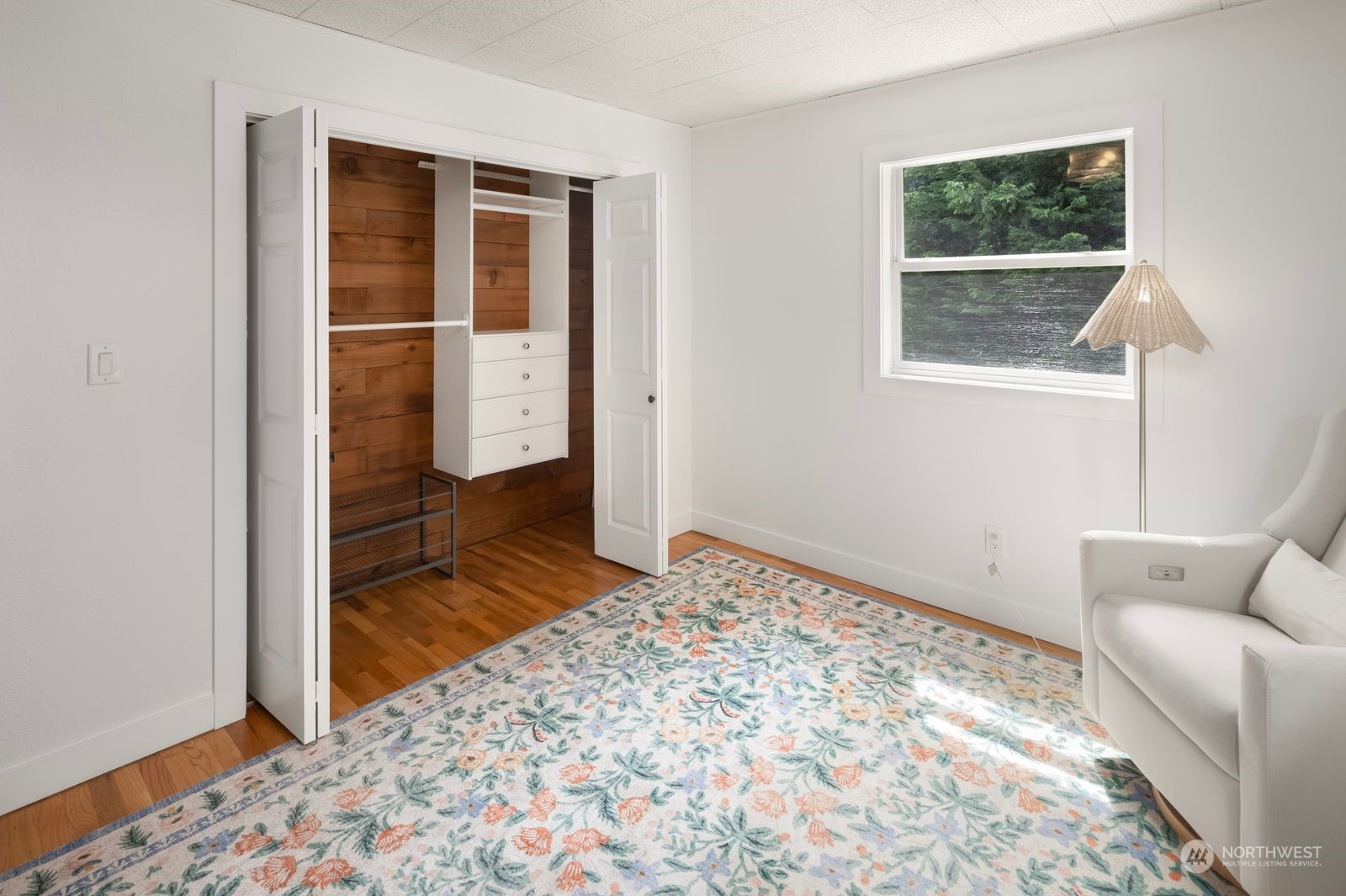 1417 North 40th Street Renton, WA 98056 - Photo 18 of 33 a view of a bedroom with wooden floor and a window