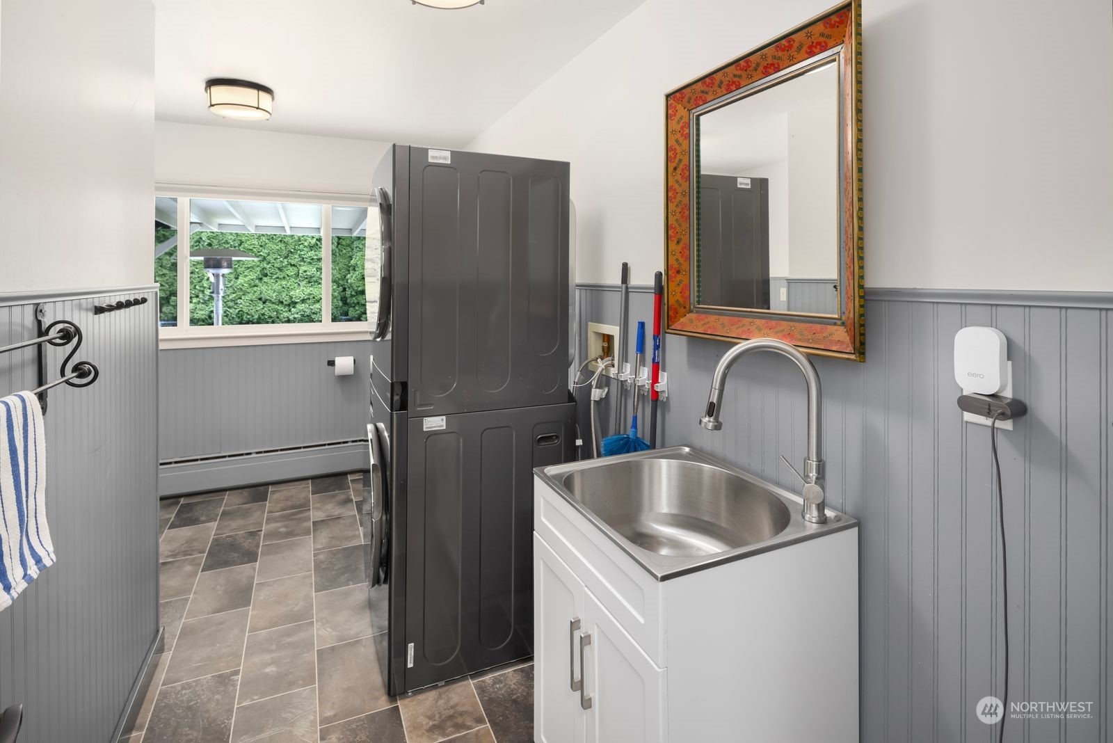 1417 North 40th Street Renton, WA 98056 - Photo 19 of 33 a bathroom with a sink and a large mirror