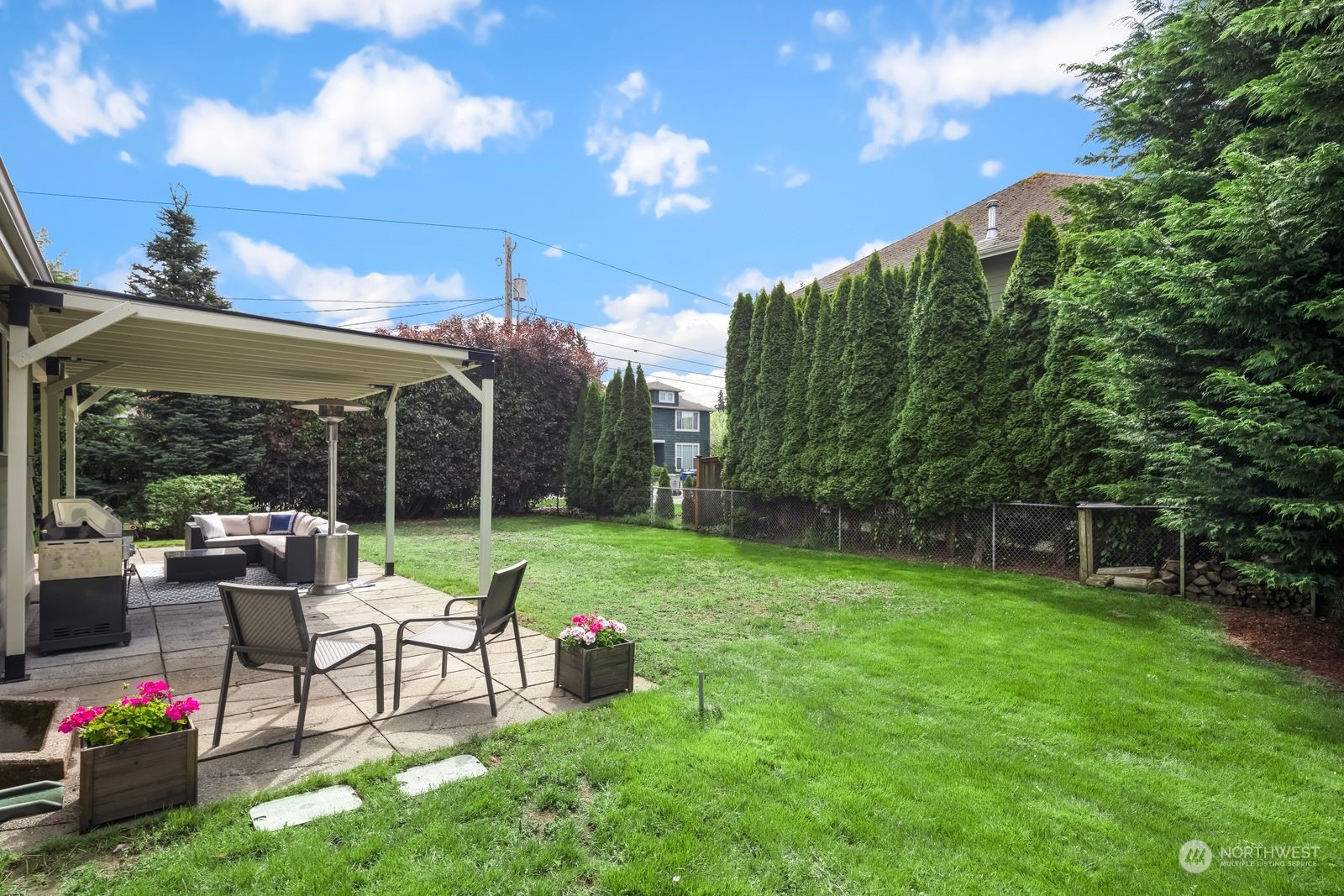 1417 North 40th Street Renton, WA 98056 - Photo 26 of 33 a view of a chair and tables in the garden