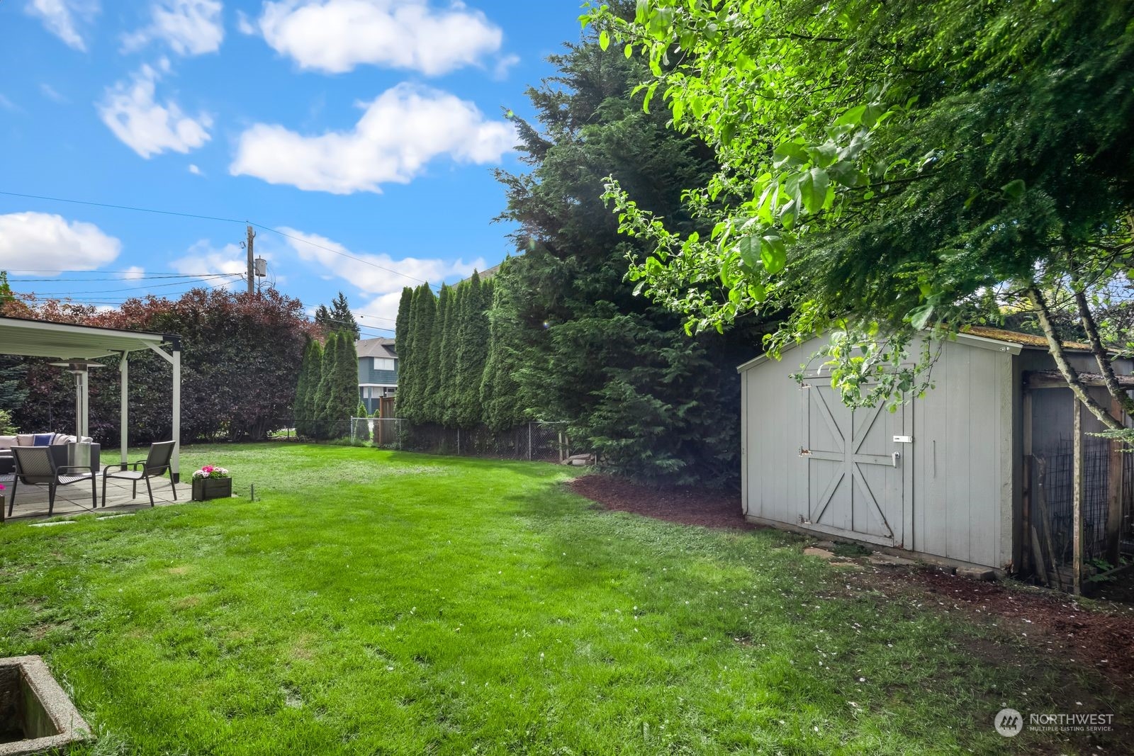 1417 North 40th Street Renton, WA 98056 - Photo 28 of 33 a view of a yard with a tree