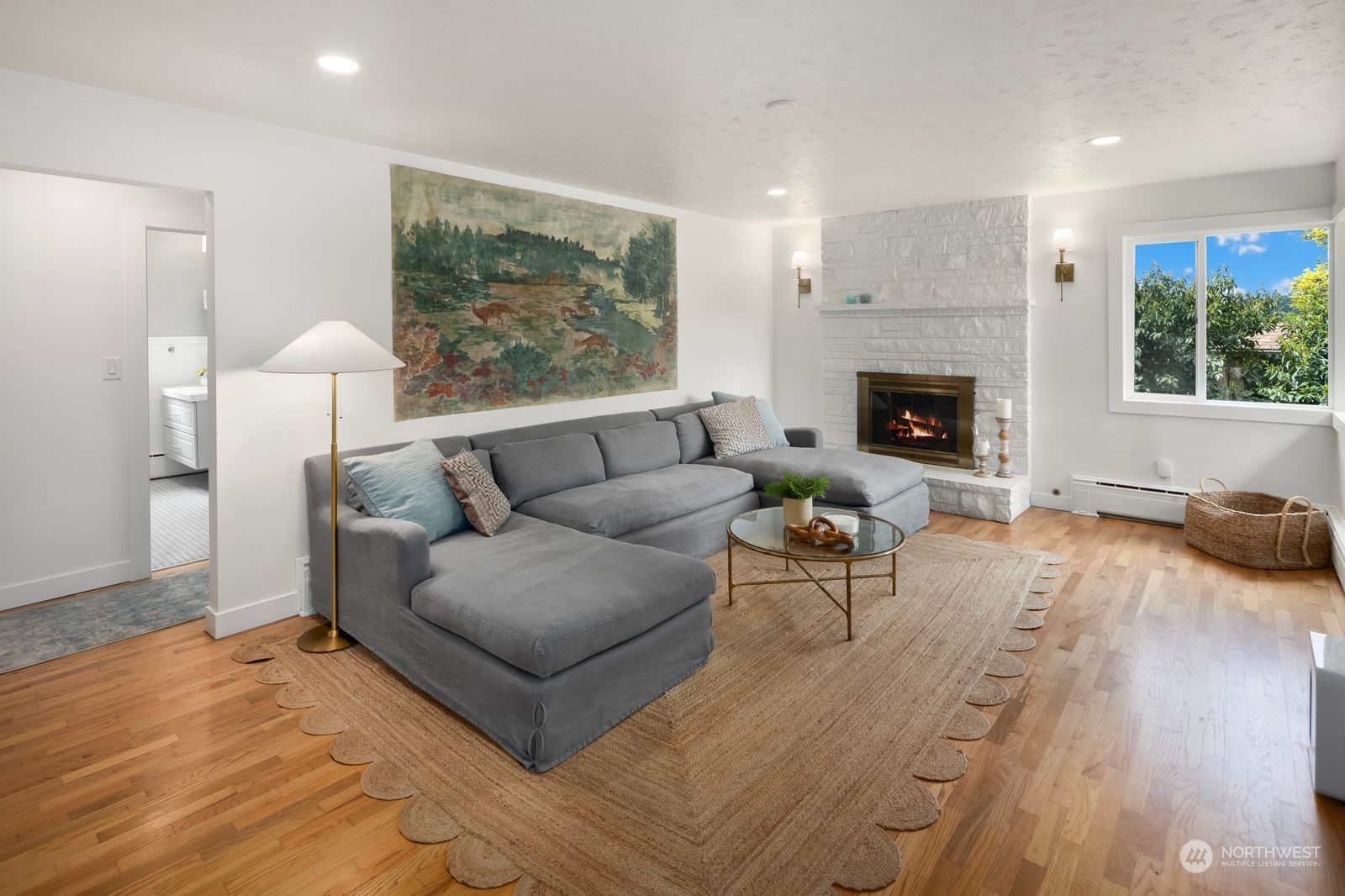1417 North 40th Street Renton, WA 98056 - Photo 7 of 33 a living room with furniture and a fireplace