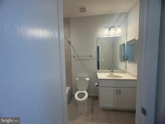 a bathroom with a double vanity sink and mirror