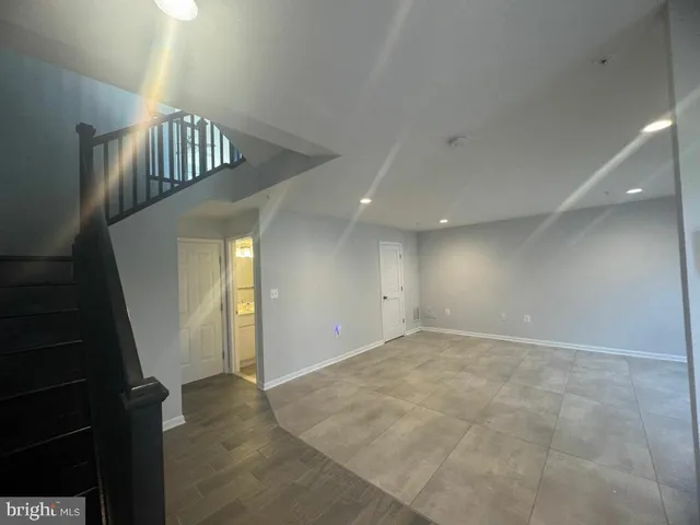a view of kitchen with sink and wooden floor