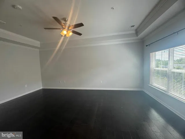 a bathroom with a double vanity sink bathtub and next to a window