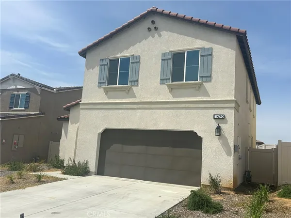 a front view of a house with a garage