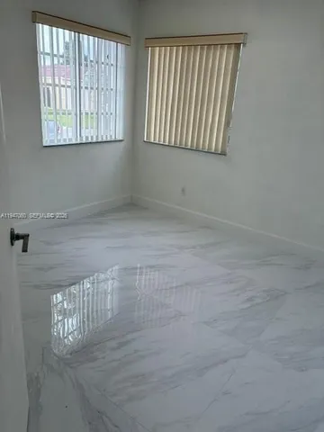 a view of a livingroom with an entryway