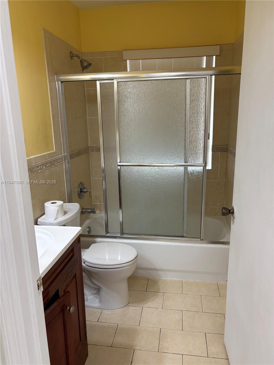 17365 Southwest 142nd Court Miami, FL 33177 - Photo 15 of 18 a bathroom with a granite countertop sink toilet and shower