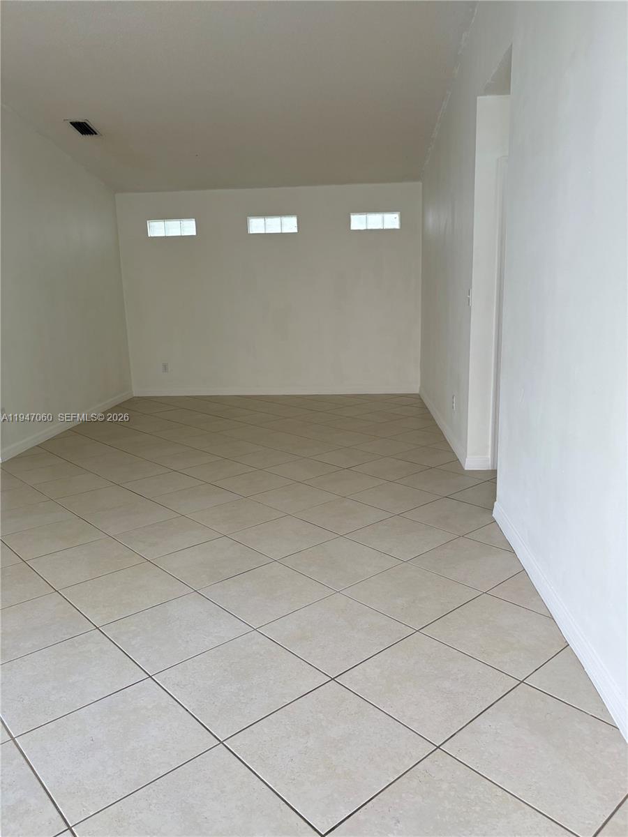 17365 Southwest 142nd Court Miami, FL 33177 - Photo 16 of 18 a view of a room with parking space