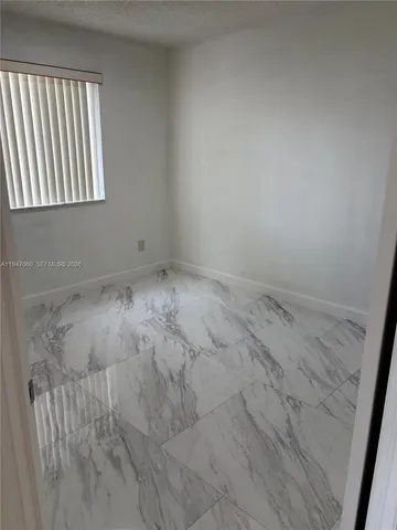 a view of a room that has a window in it