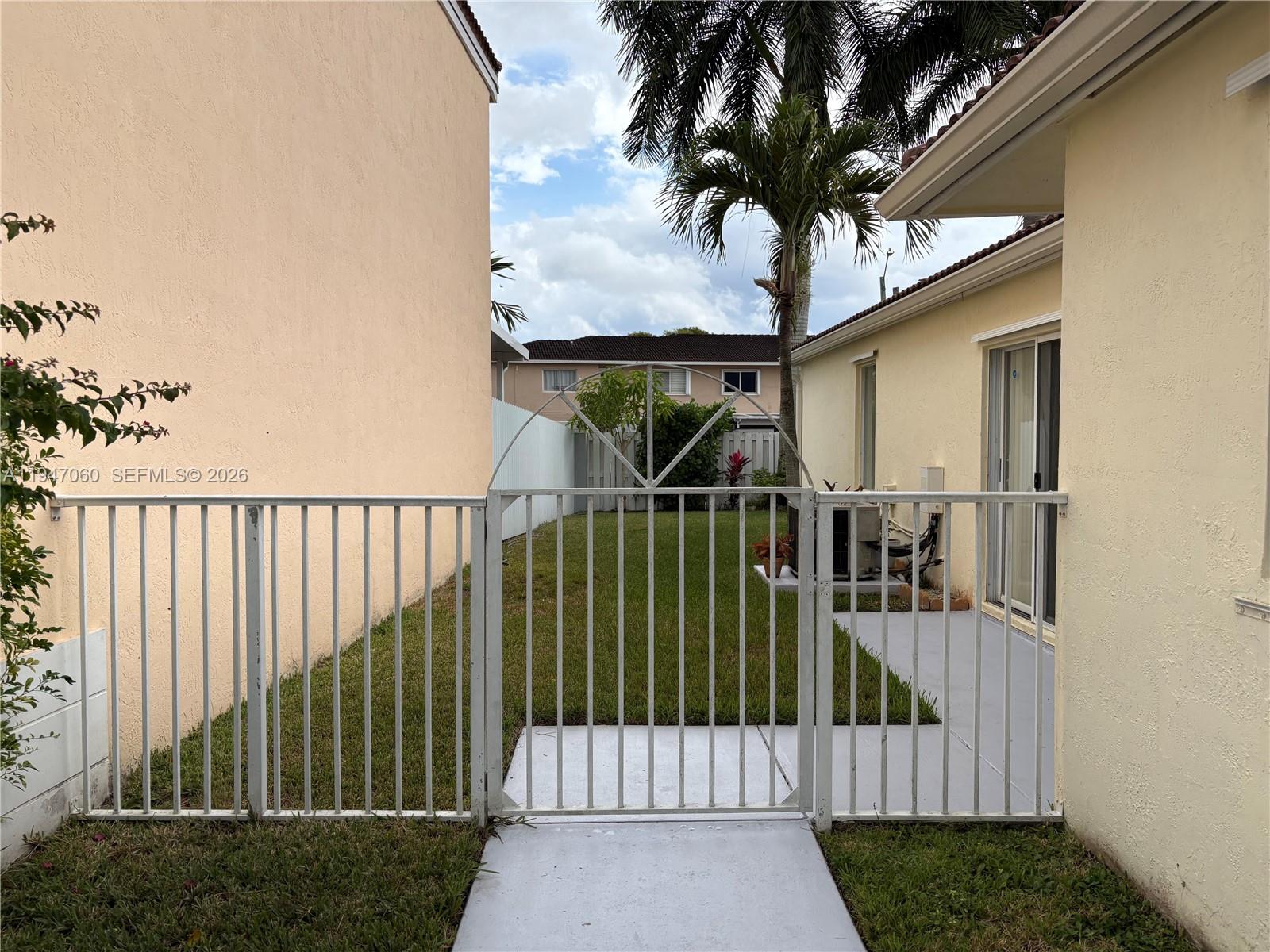 17365 Southwest 142nd Court Miami, FL 33177 - Photo 2 of 18 a view of a balcony with a potted plant
