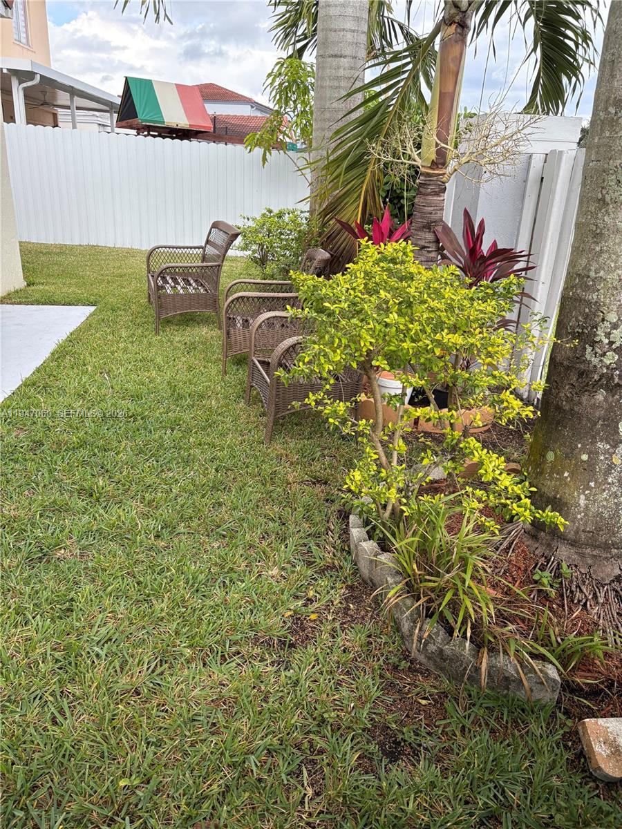 17365 Southwest 142nd Court Miami, FL 33177 - Photo 4 of 18 a backyard of a house with lots of green space