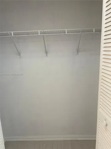 a view of a room with racks on the wall