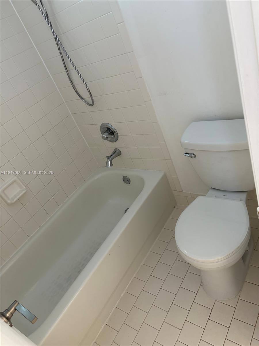 17365 Southwest 142nd Court Miami, FL 33177 - Photo 10 of 18 a bathroom with a toilet and a bathtub