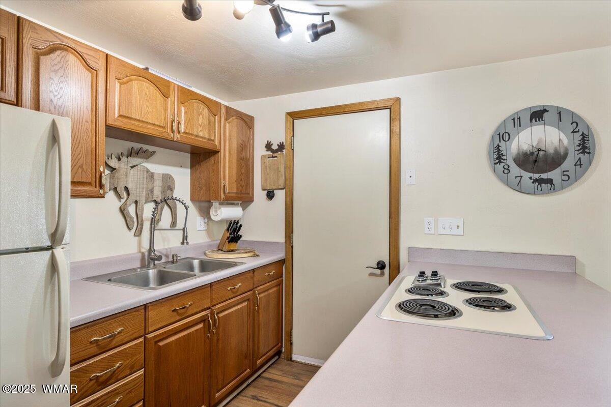 2001 Broken Arrow Road Overgaard, AZ 85933 - Photo 12 of 38 a kitchen with stainless steel appliances granite countertop a sink stove and refrigerator