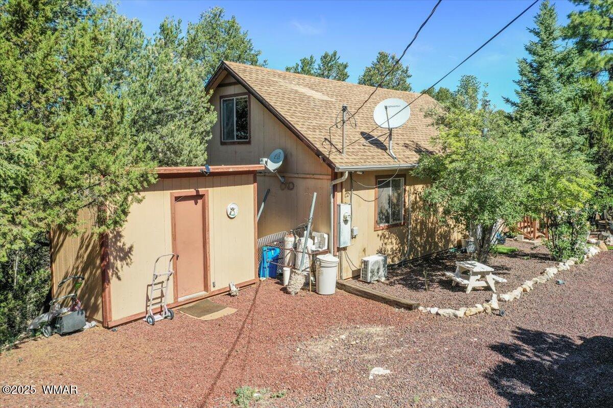 2001 Broken Arrow Road Overgaard, AZ 85933 - Photo 27 of 38 a view of a house with a patio