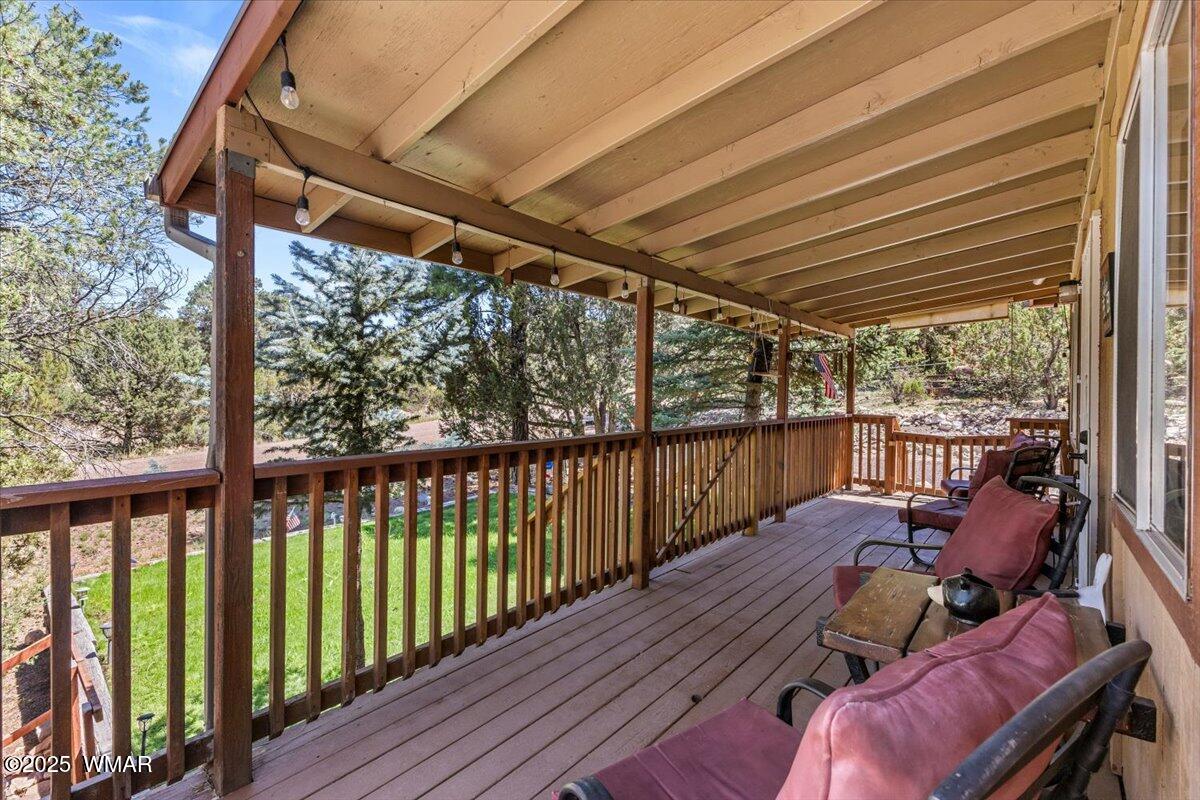2001 Broken Arrow Road Overgaard, AZ 85933 - Photo 6 of 38 a view of balcony with wooden floor