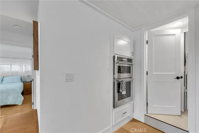 a bathroom with a granite countertop sink mirror vanity and toilet