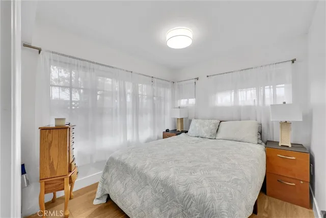 a bedroom with a bed and cabinets