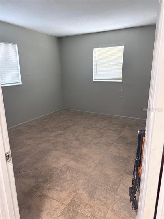 1420 Belleview Road Cocoa, FL 32922 - Photo 13 of 14 an empty room with a window