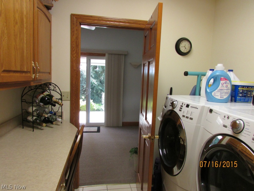 4645 Rock Spring Road Ravenna, OH 44266 - Photo 24 of 25 The first floor has a laundry room that connects to the study. There are custom cabinets and a folding area. This house has everything!