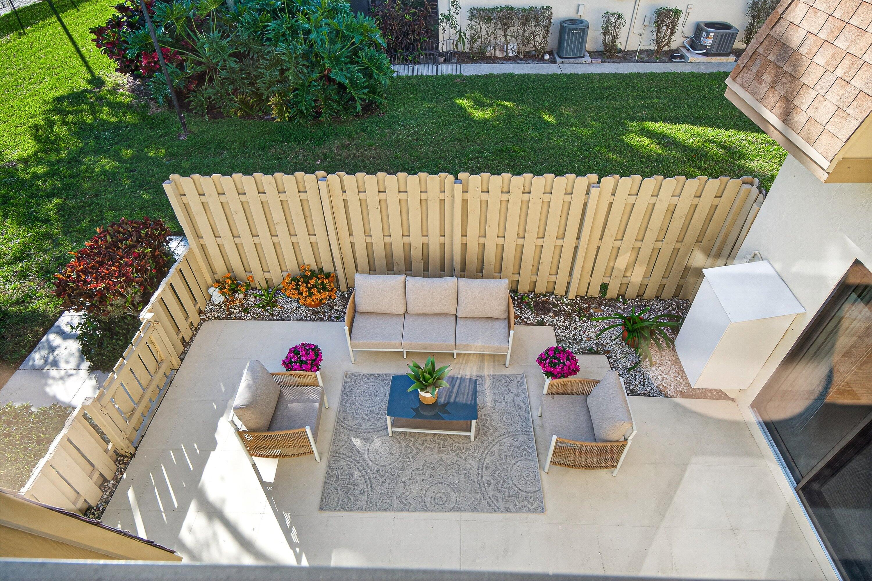865 Northwest 29th Avenue, Unit D Delray Beach, FL 33445 - Photo 3 of 70 swimming pool view with a garden