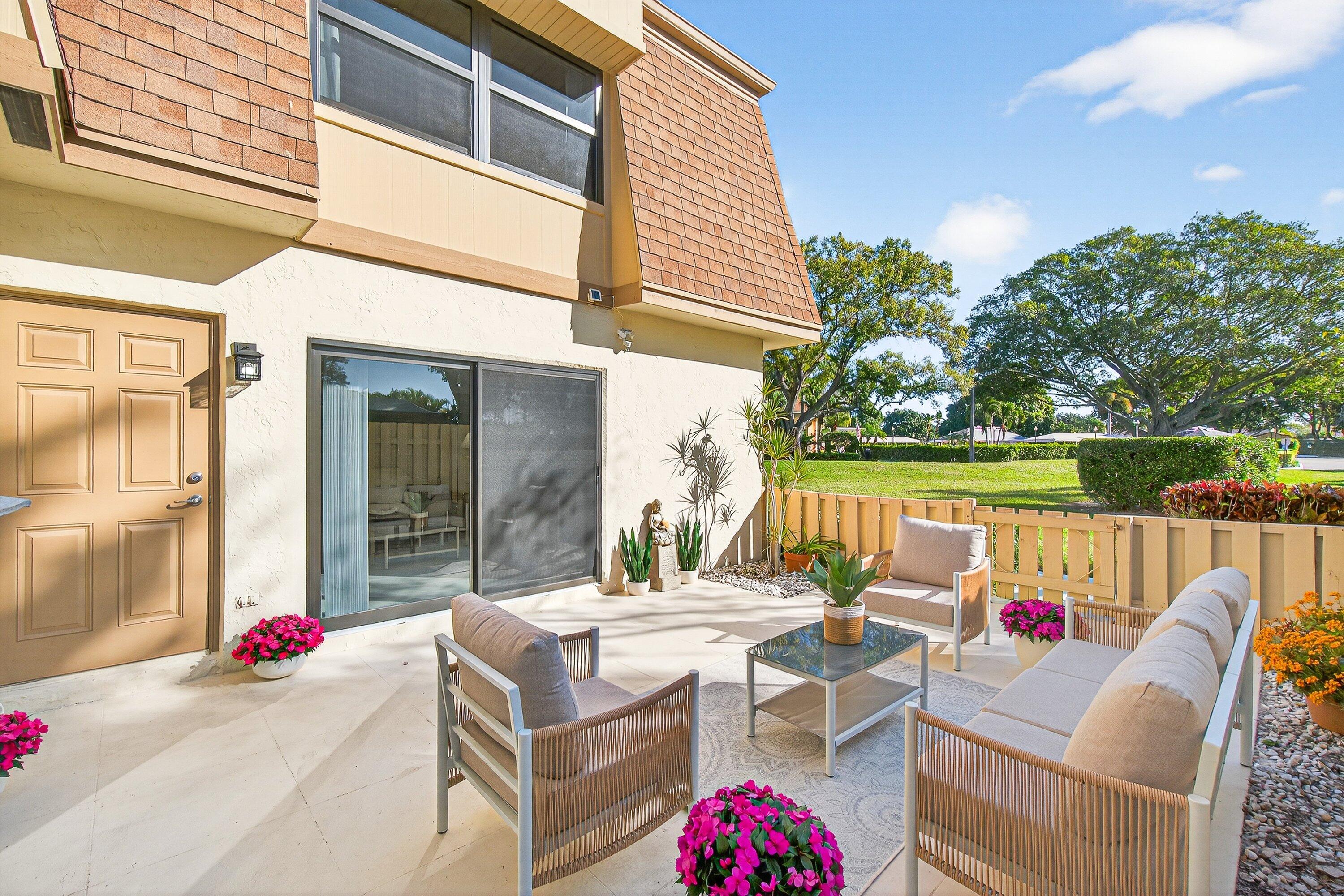 865 Northwest 29th Avenue, Unit D Delray Beach, FL 33445 - Photo 32 of 70 a view of outdoor space yard and patio