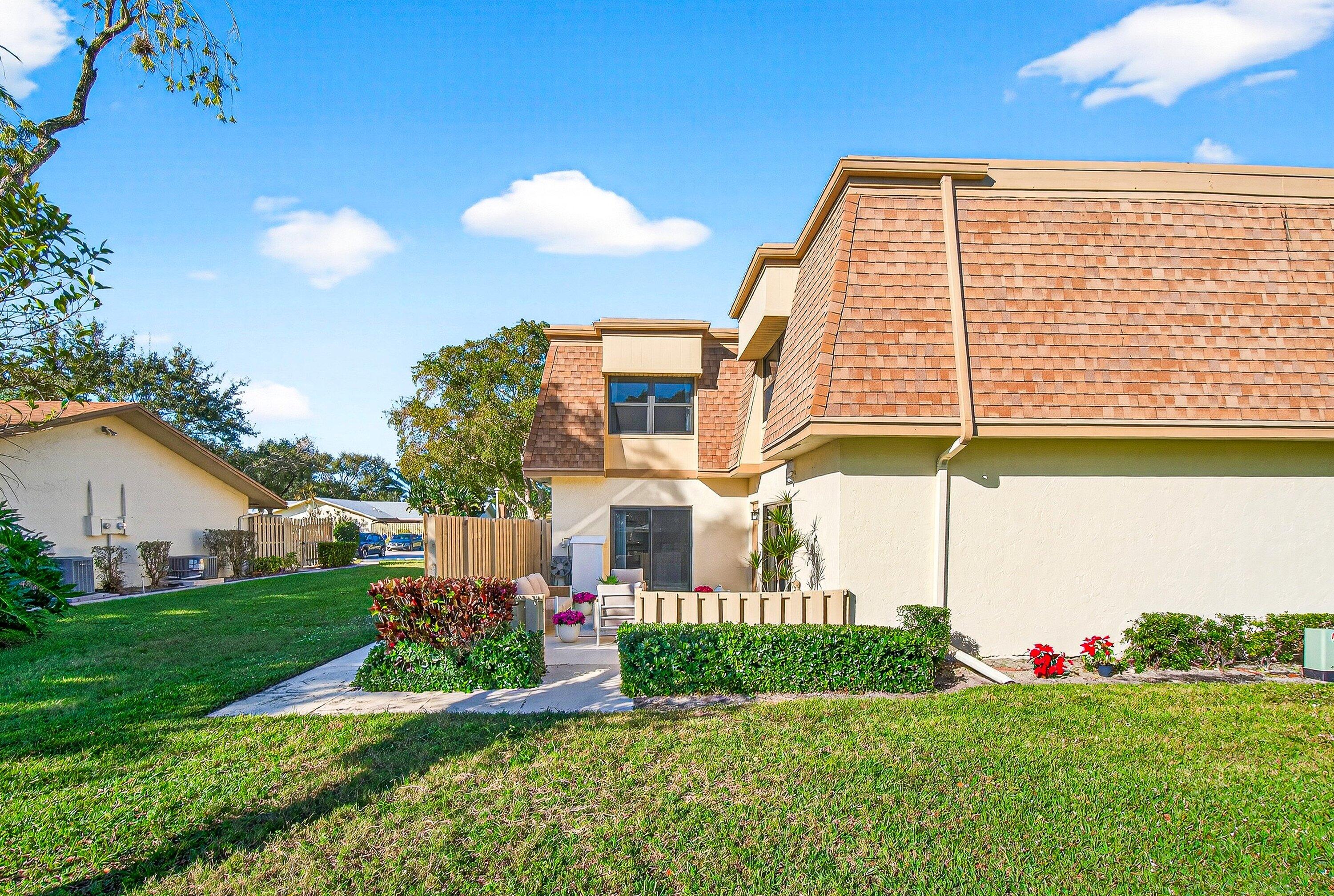 865 Northwest 29th Avenue, Unit D Delray Beach, FL 33445 - Photo 35 of 70 a front view of house with yard