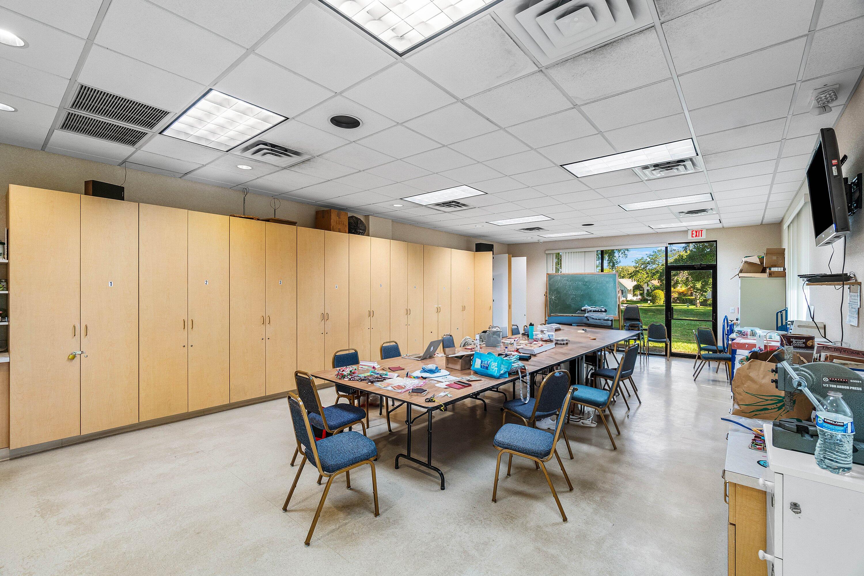 865 Northwest 29th Avenue, Unit D Delray Beach, FL 33445 - Photo 46 of 70 a view of a dining room with furniture window and outside view