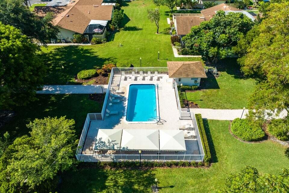 865 Northwest 29th Avenue, Unit D Delray Beach, FL 33445 - Photo 49 of 70 an aerial view of a house with a yard