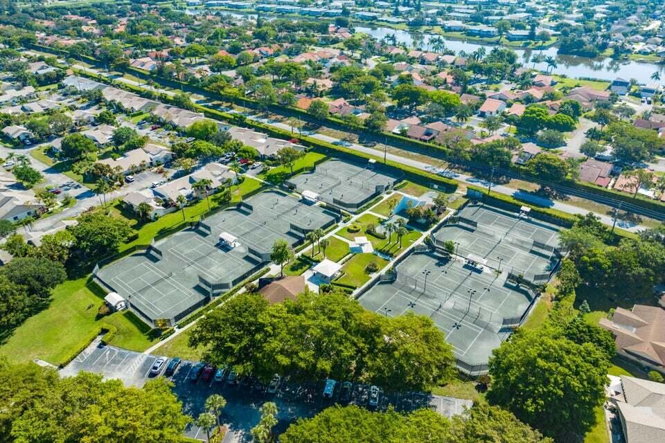865 Northwest 29th Avenue, Unit D Delray Beach, FL 33445 - Photo 52 of 70 an aerial view of a residential houses with outdoor space and street view