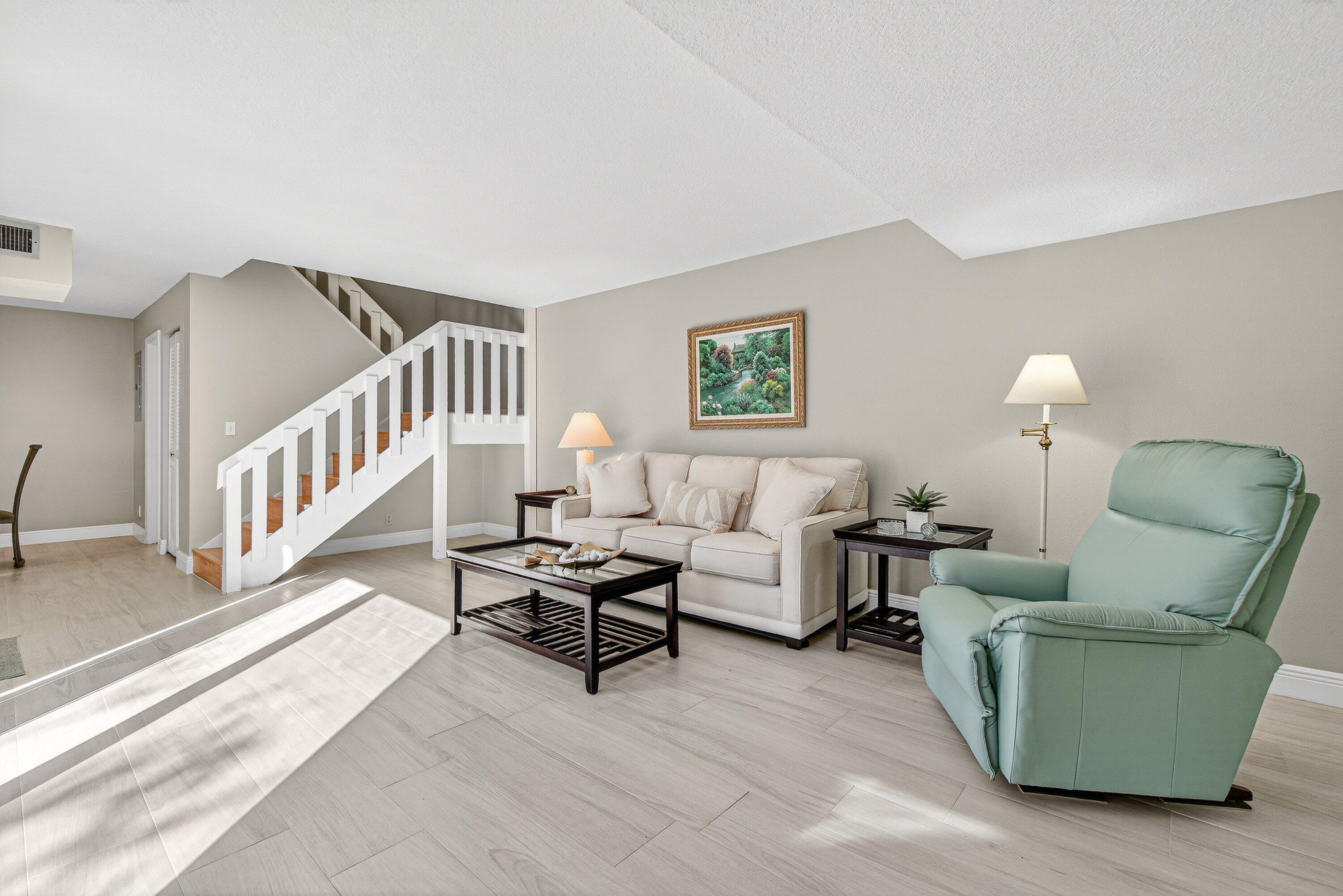 865 Northwest 29th Avenue, Unit D Delray Beach, FL 33445 - Photo 6 of 70 a living room with furniture and a table