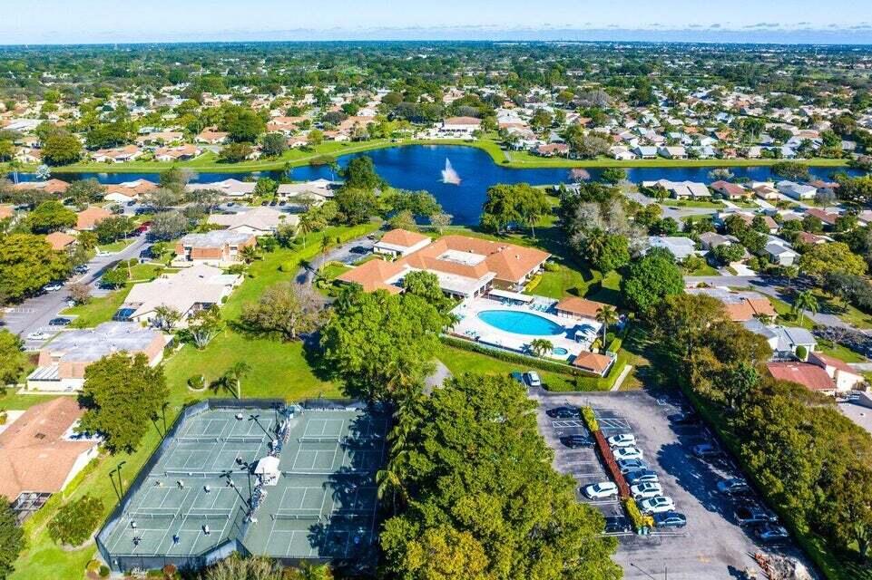 865 Northwest 29th Avenue, Unit D Delray Beach, FL 33445 - Photo 61 of 70 an aerial view of residential houses with outdoor space