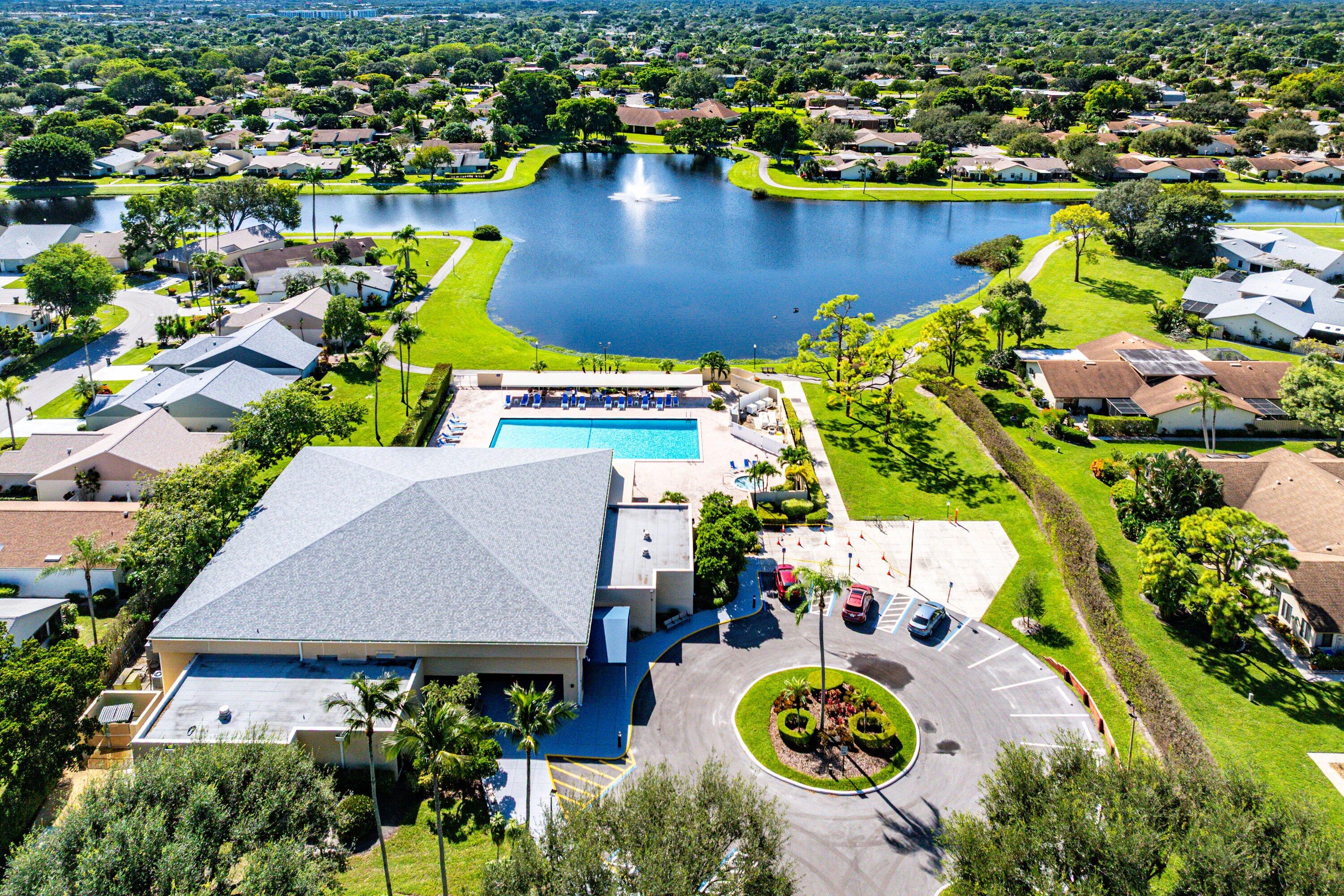 865 Northwest 29th Avenue, Unit D Delray Beach, FL 33445 - Photo 65 of 70 an aerial view of a house with swimming pool and outdoor seating