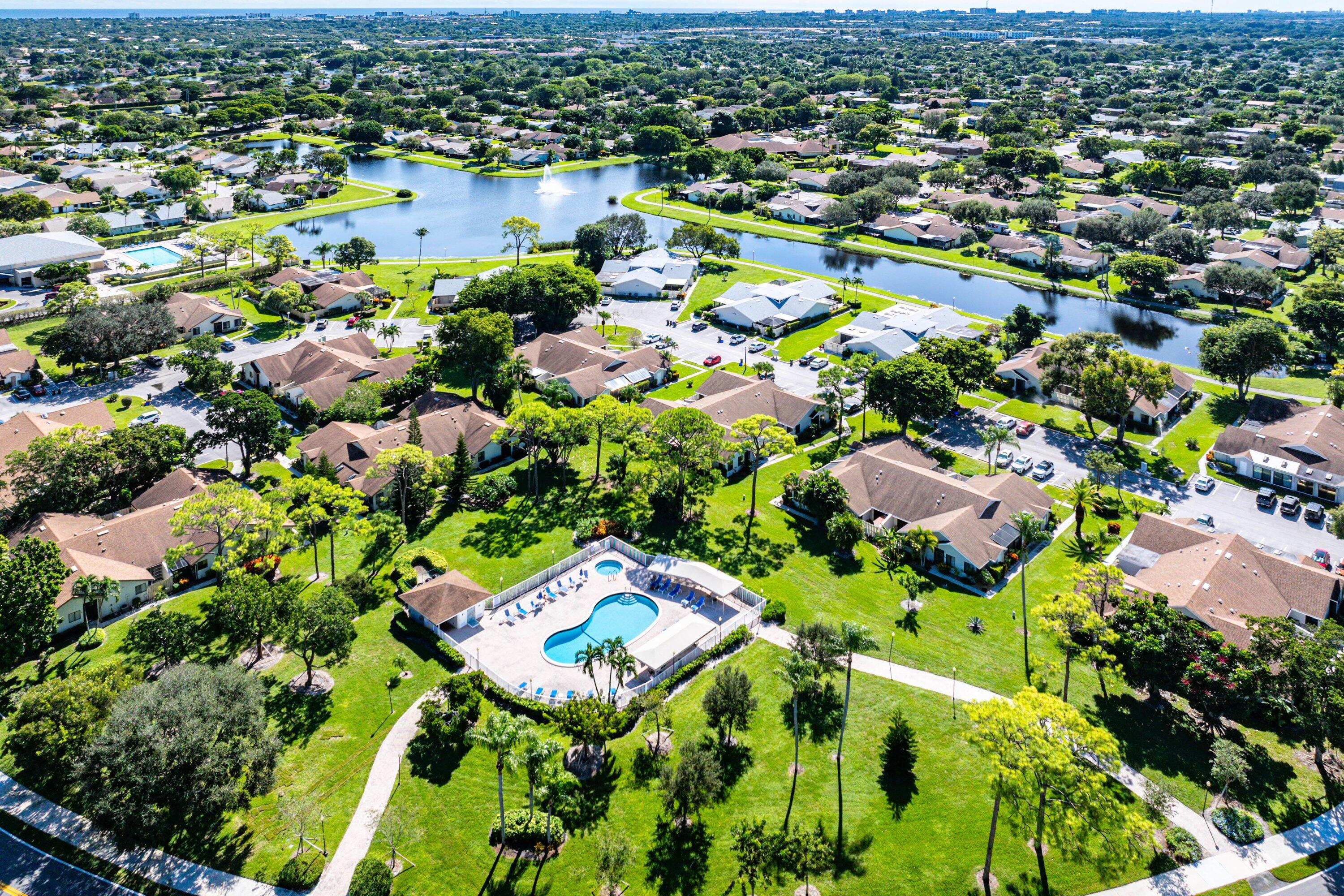 865 Northwest 29th Avenue, Unit D Delray Beach, FL 33445 - Photo 67 of 70 an aerial view of residential houses with outdoor space
