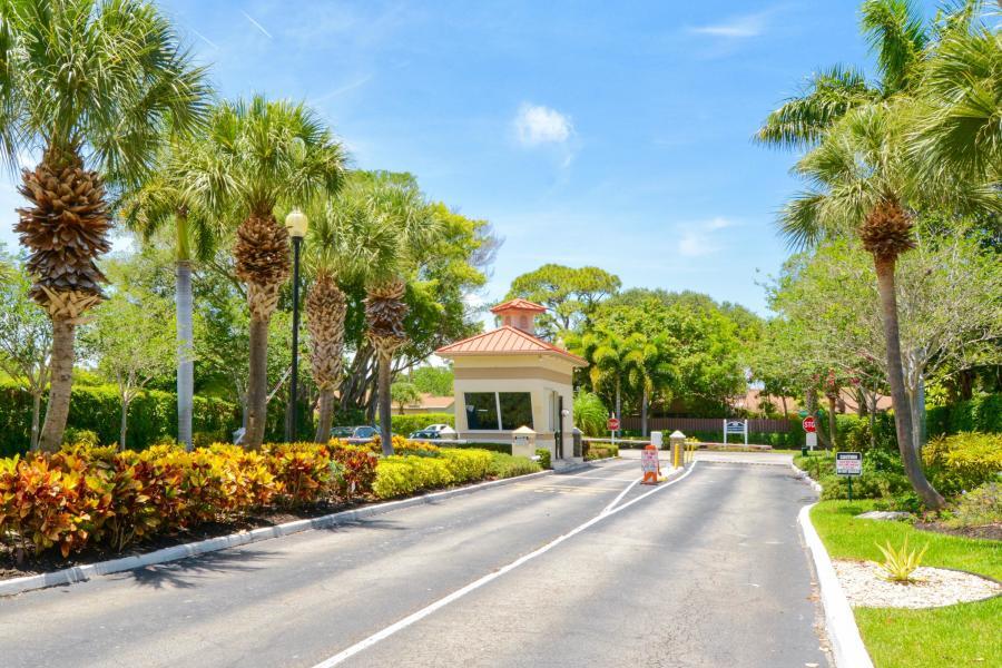 865 Northwest 29th Avenue, Unit D Delray Beach, FL 33445 - Photo 70 of 70 a front view of a house with a garden