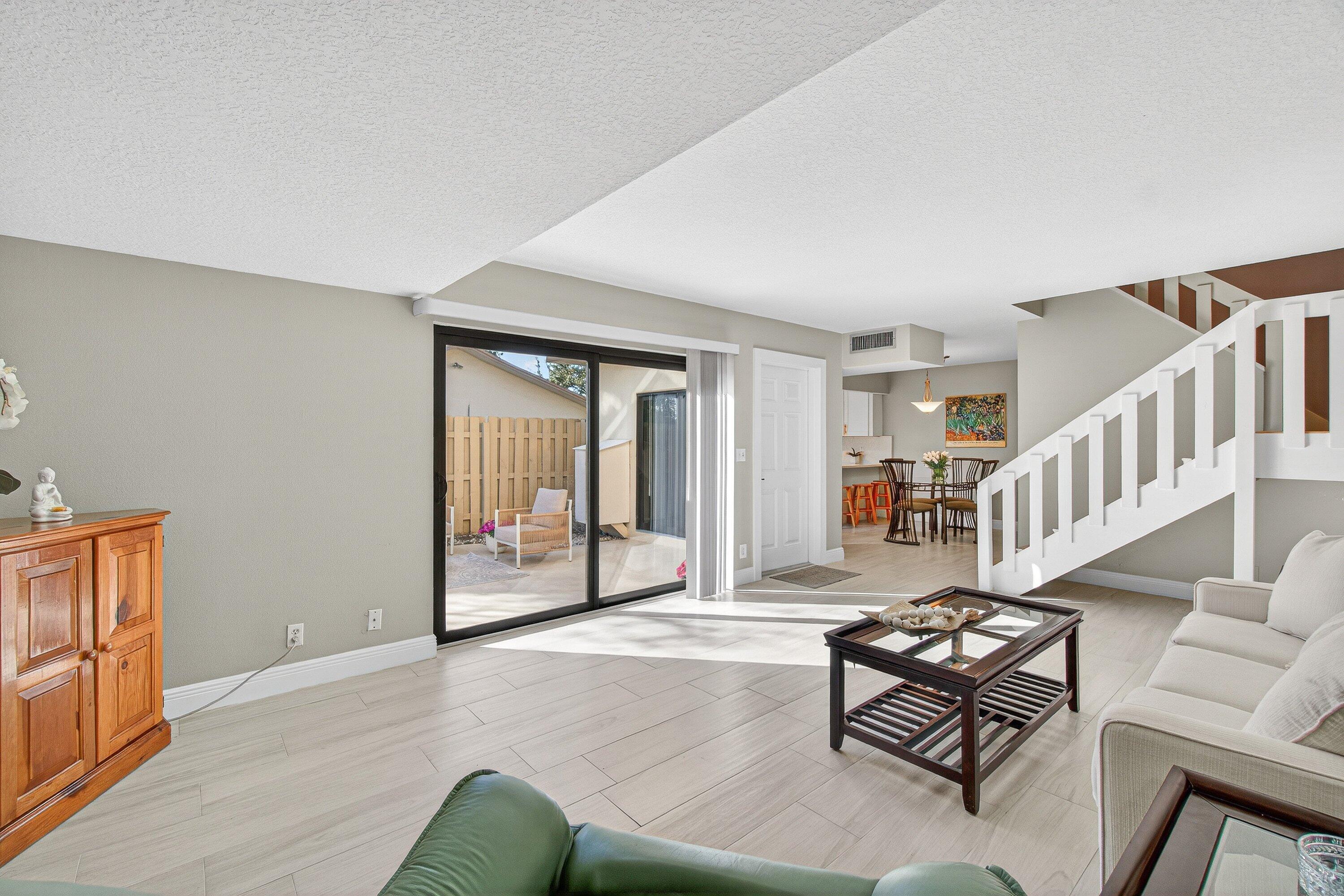 865 Northwest 29th Avenue, Unit D Delray Beach, FL 33445 - Photo 8 of 70 a living room with furniture and wooden floor