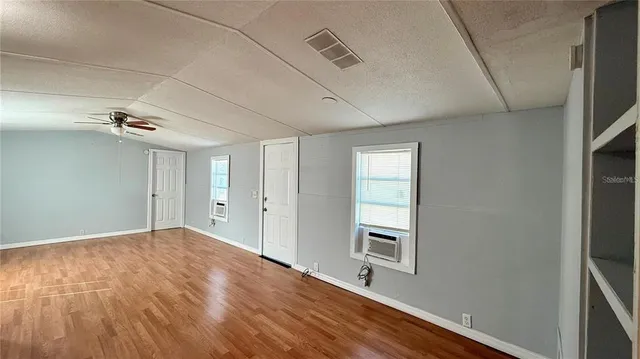 a view of an empty room with a window