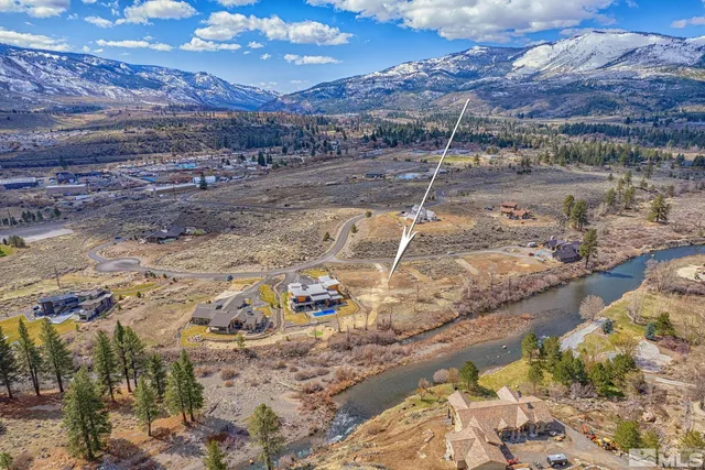 a view of a backyard with wooden fence