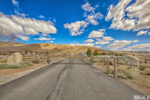 a view of an ocean with a building in the background
