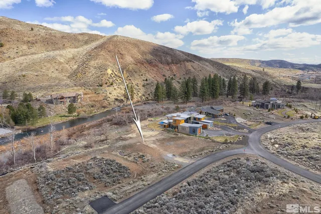 a view of a backyard with wooden fence