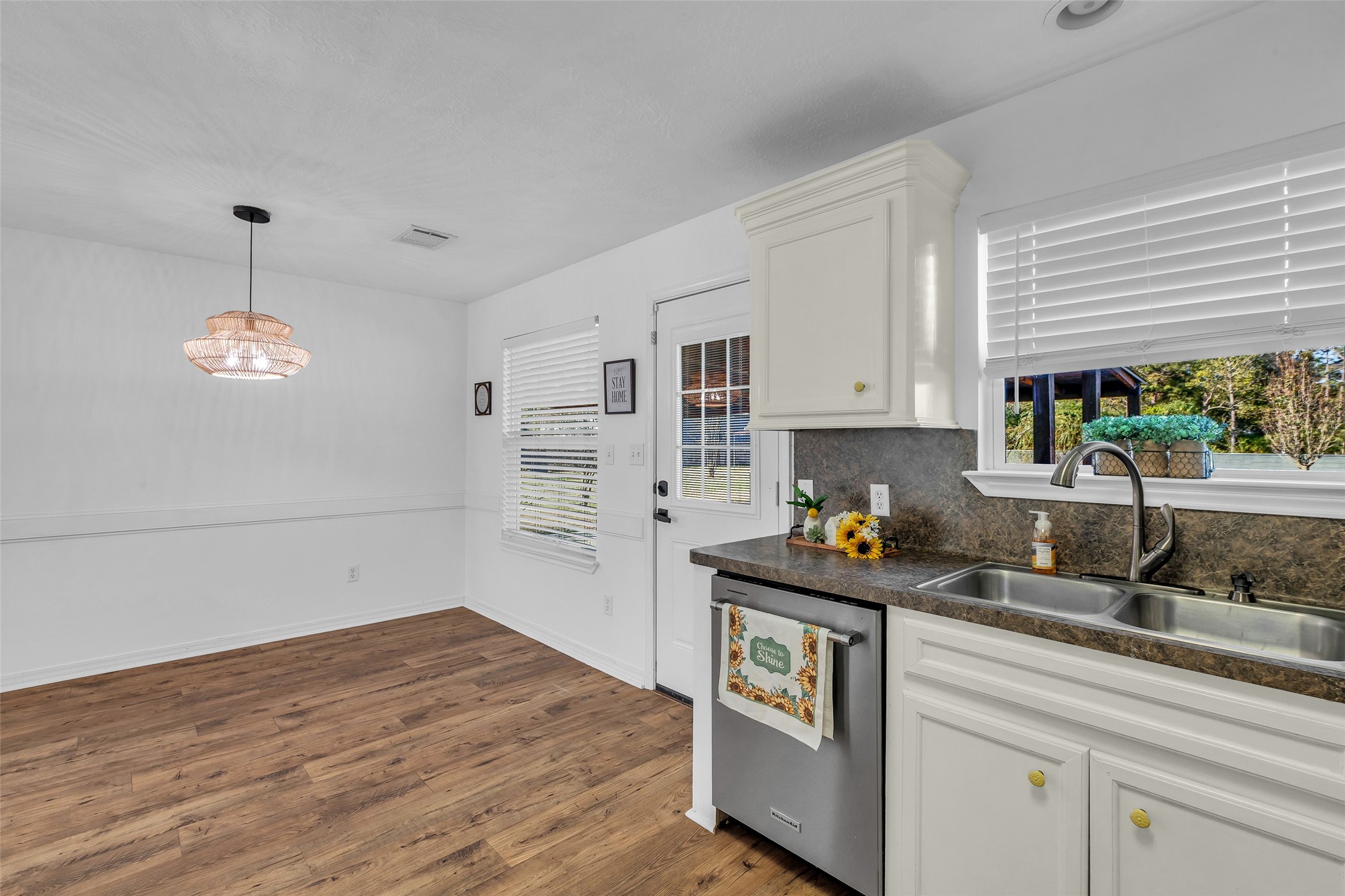 3862 Highline Oaks West Conroe, TX 77306 - Photo 13 of 23 a kitchen with stainless steel appliances granite countertop a sink and a stove next to a window
