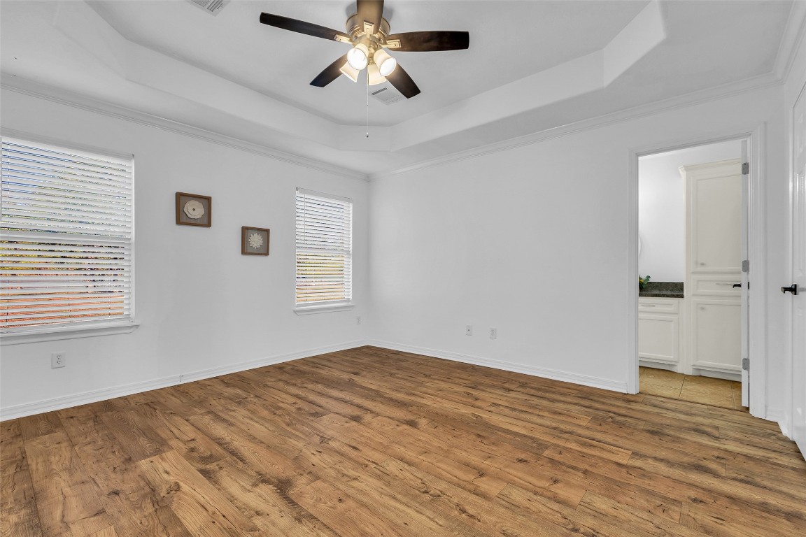 3862 Highline Oaks West Conroe, TX 77306 - Photo 18 of 23 a view of empty room with wooden floor and fan