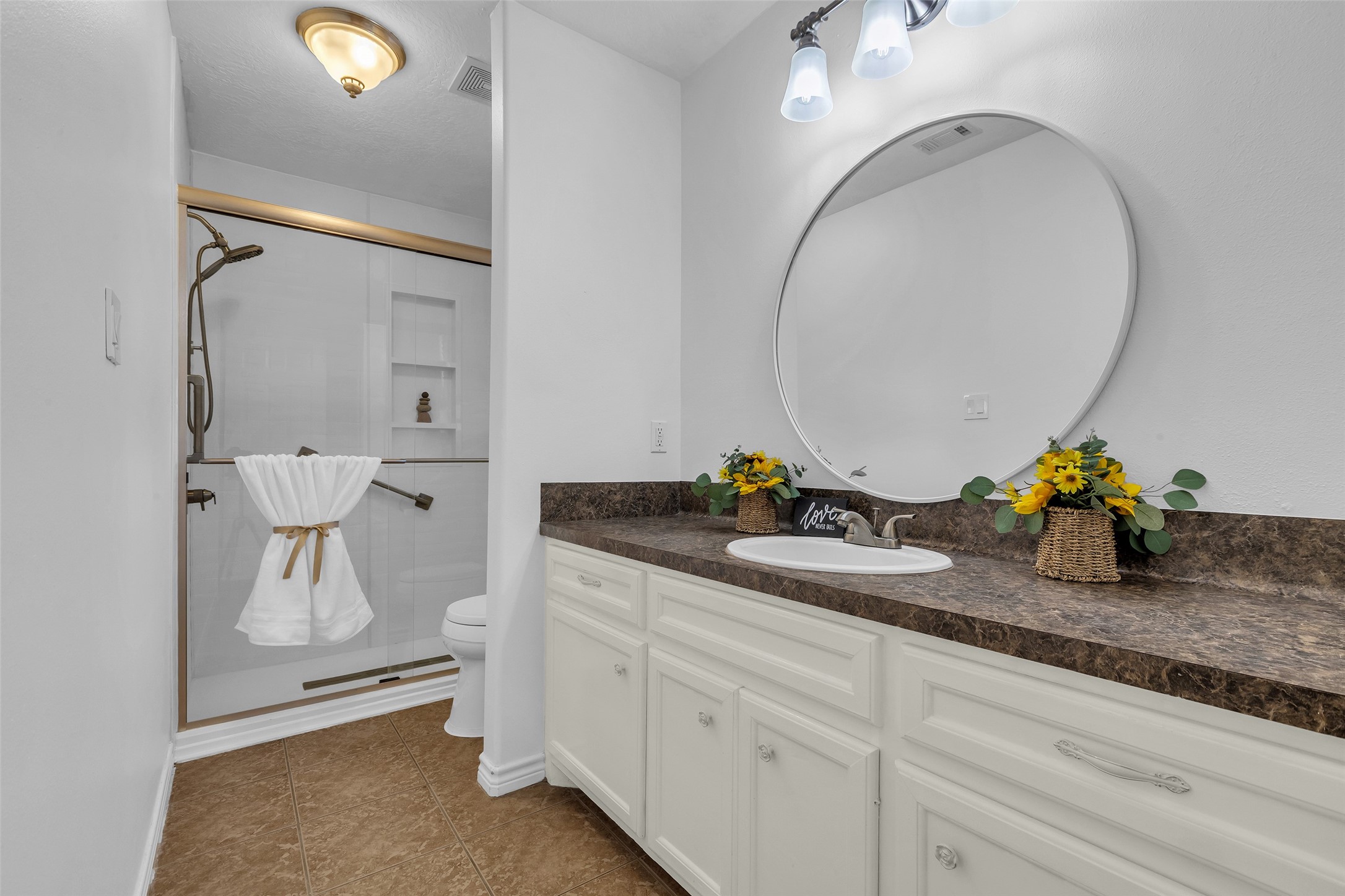 3862 Highline Oaks West Conroe, TX 77306 - Photo 19 of 23 a bathroom with a granite countertop sink a mirror and vanity