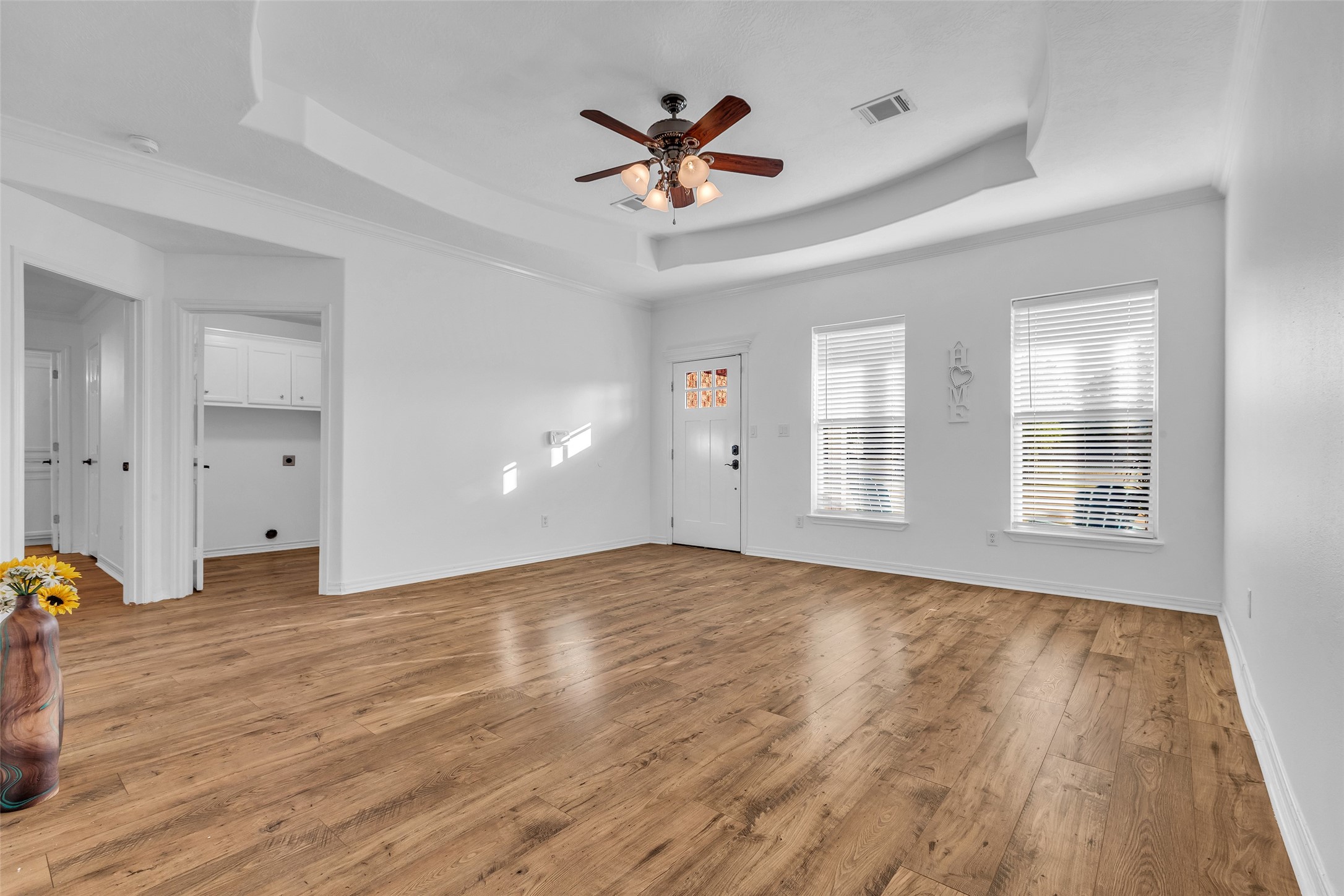 3862 Highline Oaks West Conroe, TX 77306 - Photo 5 of 23 an empty room with wooden floor and windows