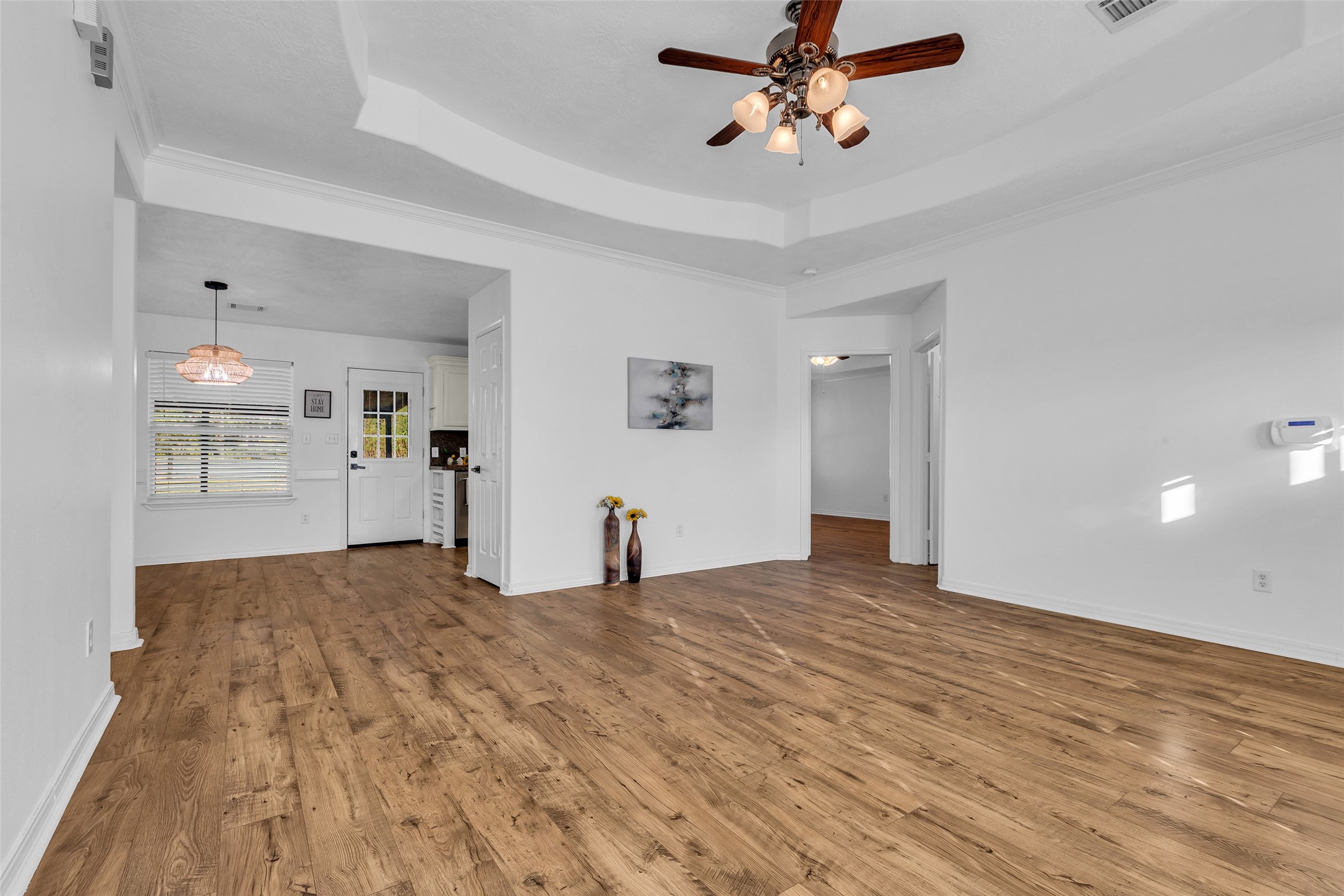 3862 Highline Oaks West Conroe, TX 77306 - Photo 10 of 23 a view of empty room with wooden floor and ceiling fan