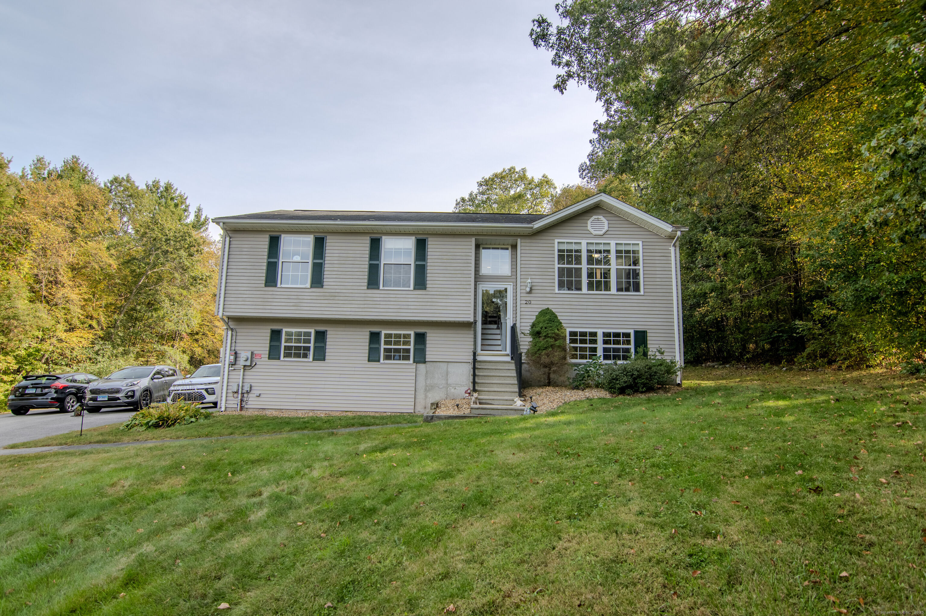 20 Pequot Circle Killingly, CT 06239 - Photo 1 of 1 a front view of house with yard and green space