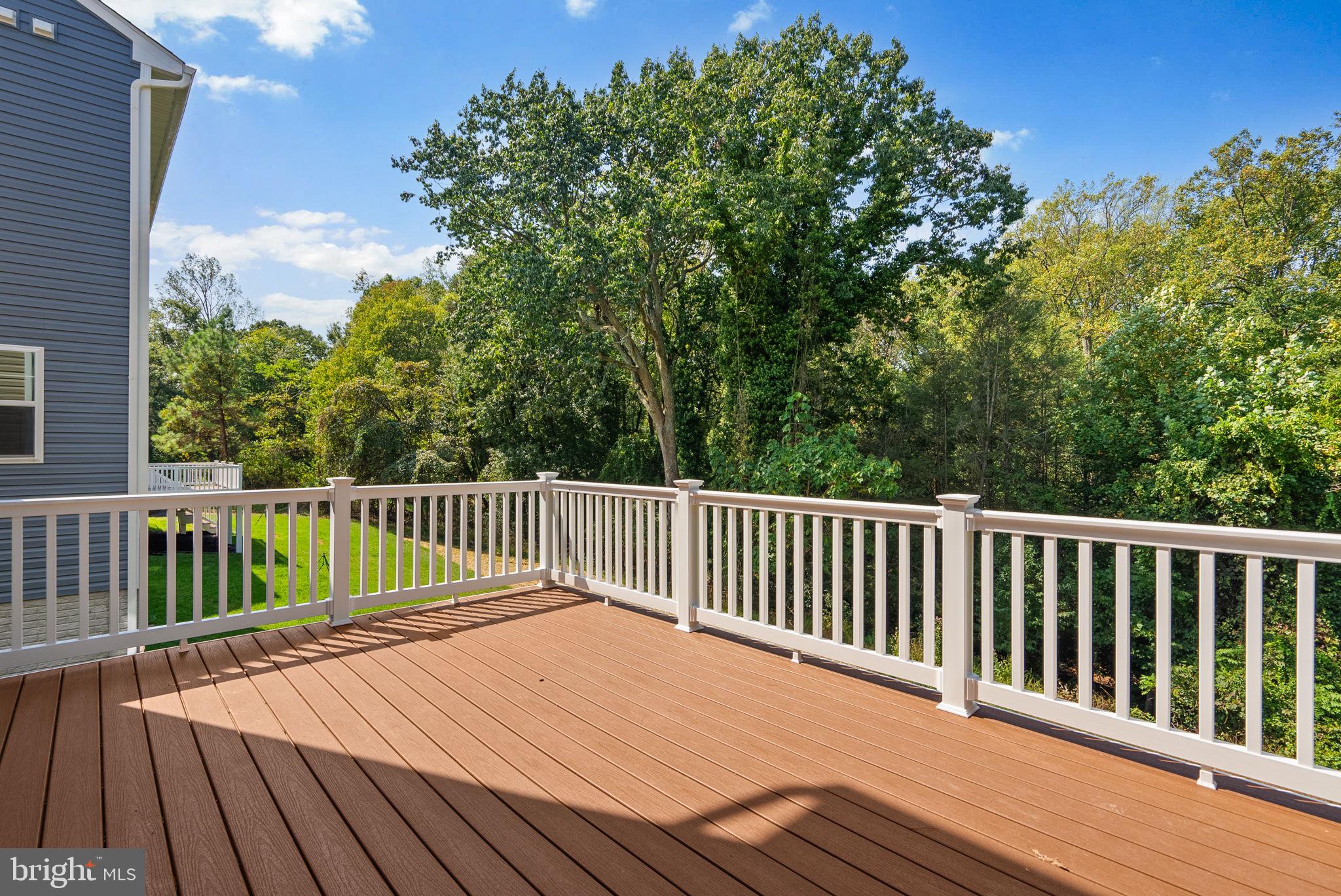 9420 Fairview Avenue Laurel, MD 20723 - Photo 20 of 70 a balcony with wooden floor and fence