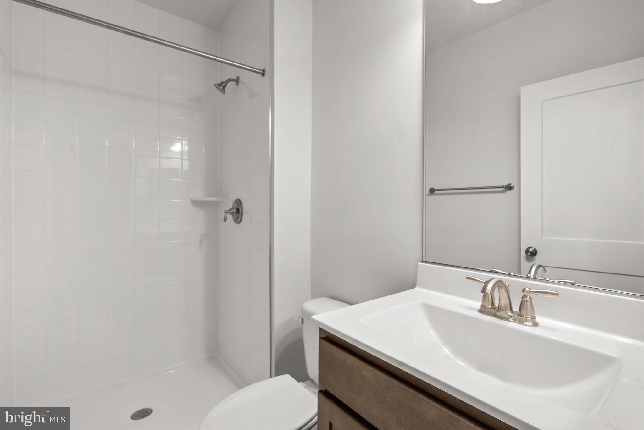 9420 Fairview Avenue Laurel, MD 20723 - Photo 60 of 70 a bathroom with a sink toilet and shower